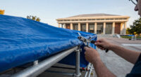 A federal judge wants answers on the tarp and scaffolding at the Kennedy Center